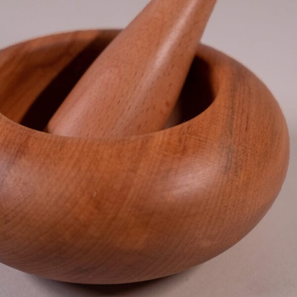 Wooden pestle - woodin water